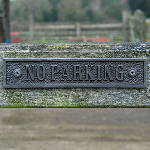 Traditional cast metal no parking gate sign