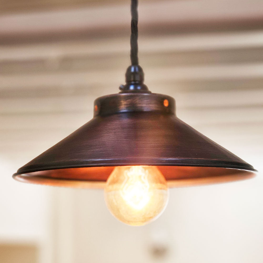 Antique copper kitchen pendant light lit up