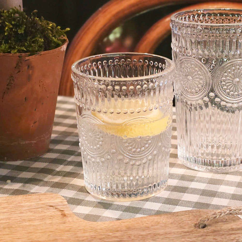 Amore glass tumbler on a table.