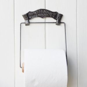 Vintage British Paper wall mounted toilet roll holder.