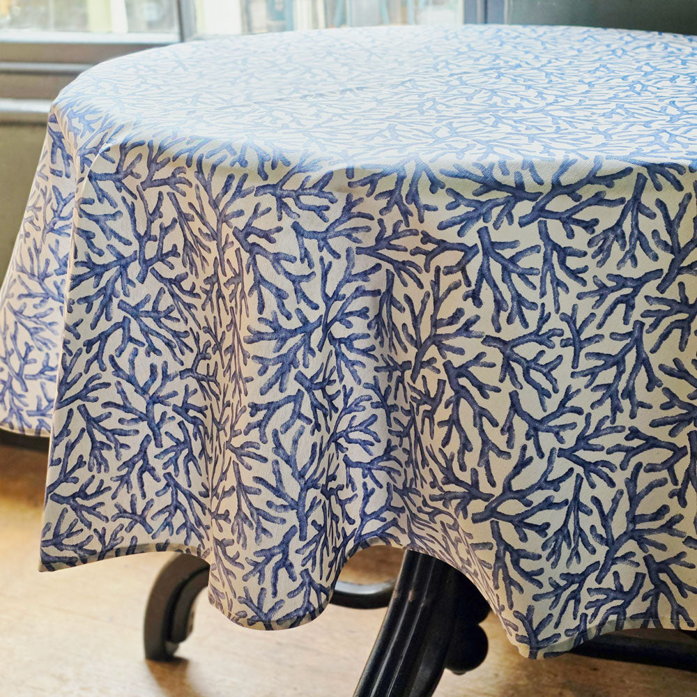 Tablecloth with blue coral pattern on a round table
