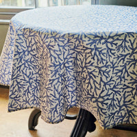 Tablecloth with blue coral pattern on a round table