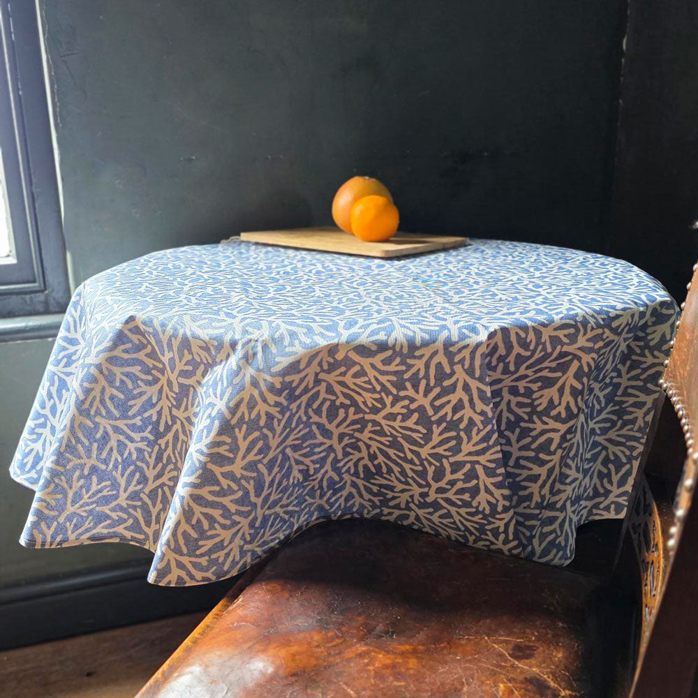 Blue reef circular tablecloth on a round table.