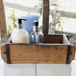 Vintage Indian wooden brick mould being used as a kitchen sink caddy