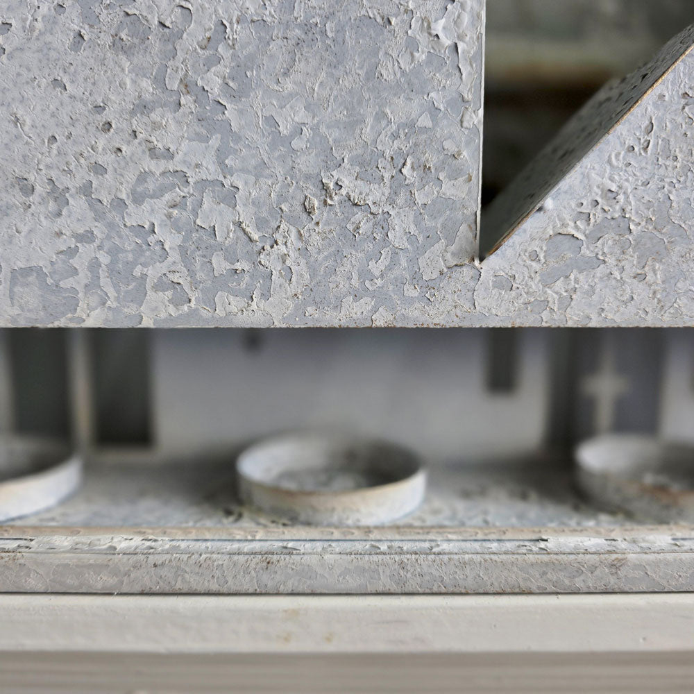 Close-up of tealight holders in the back of tealight candle houses.