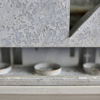Close-up of tealight holders in the back of tealight candle houses.