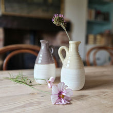 Earthenware vases on a kitchen table