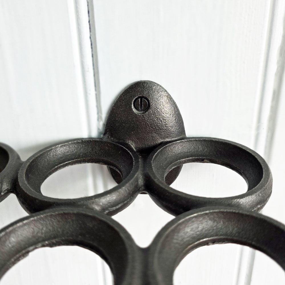 Close-up of a grey metal egg holder on a white background