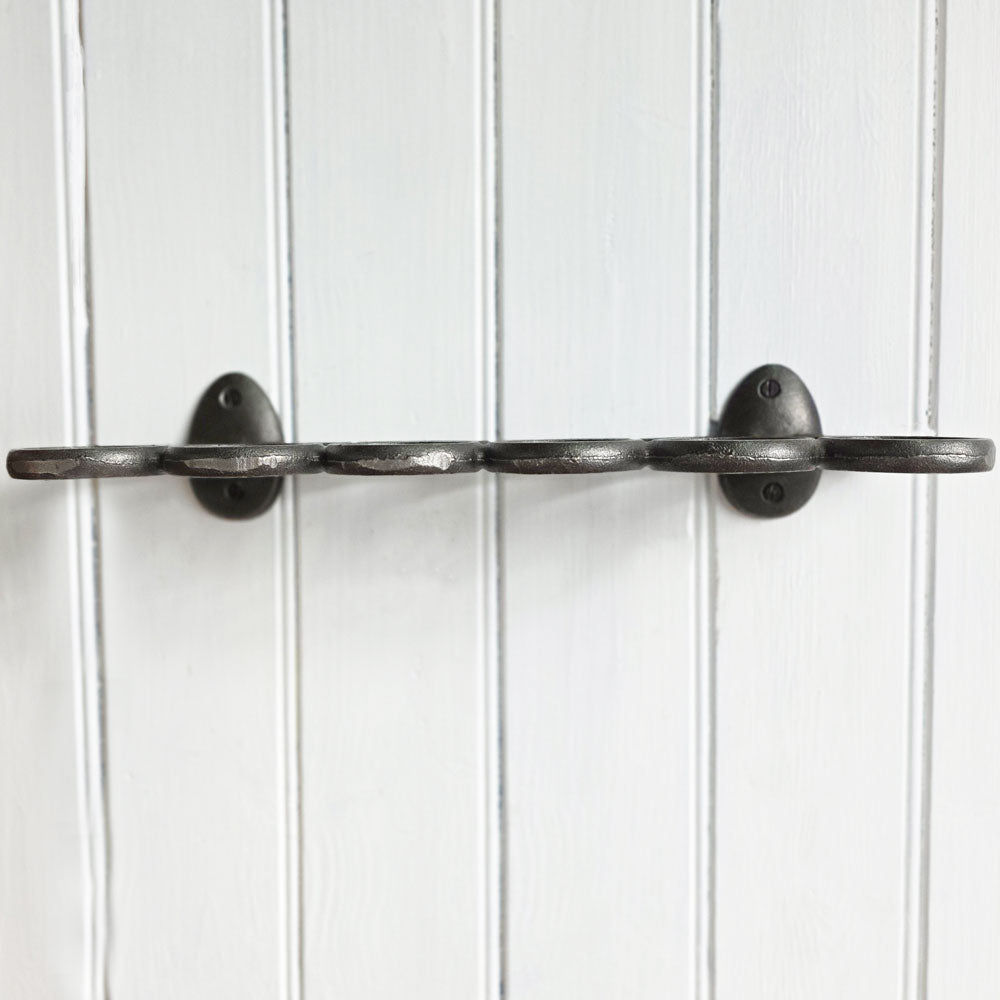 Metal egg rack  on a white paneled wall