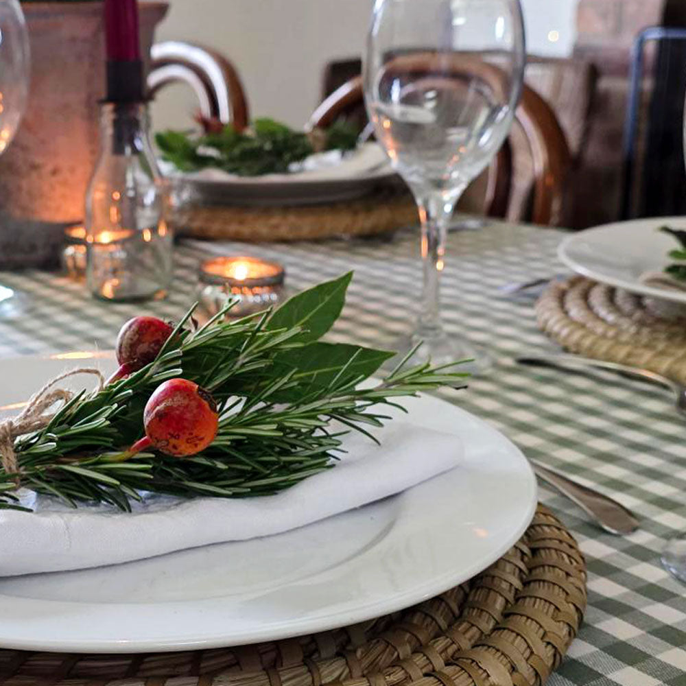 Green gingham checked wipe clean tablecloth on a Christmas table