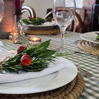 Green gingham checked wipe clean tablecloth on a Christmas table