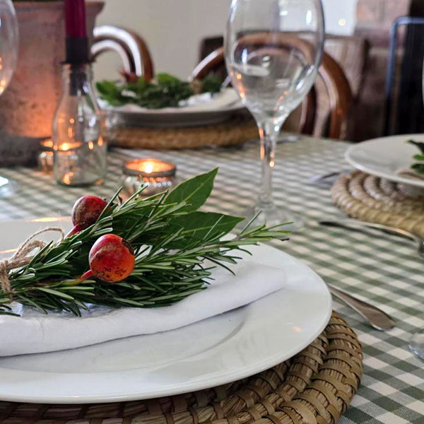 Green gingham checked wipe clean tablecloth on a Christmas table