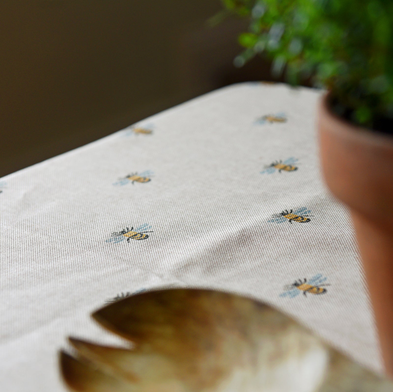 Bumblebee oilcloth tablecloth on a kitchen table