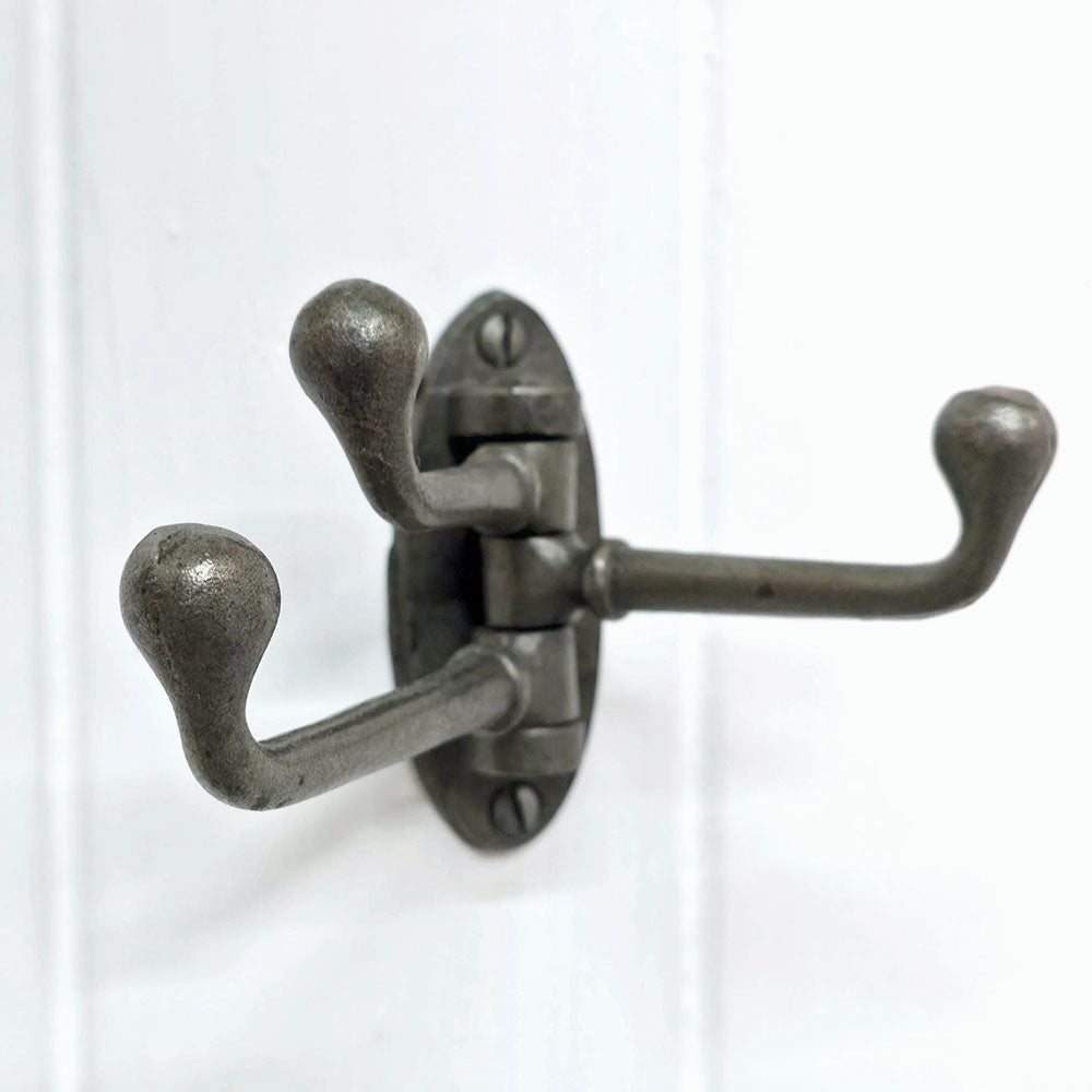 Metal iron triple hook on a white background