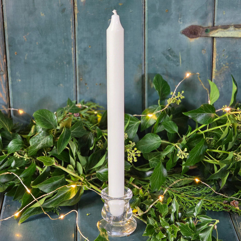 London glass candle holder with ivory dinner candle.