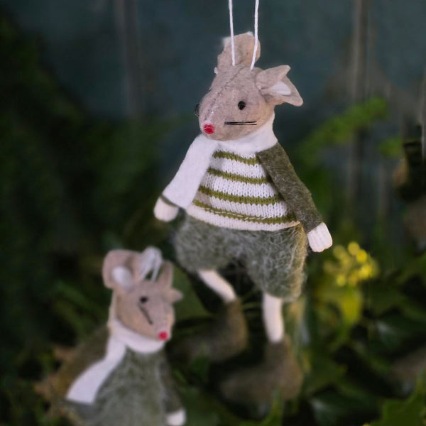 Felt mice Christmas tree decorations against foliage and tree lights.