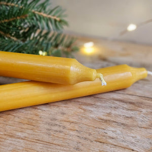 Close up of mustard dinner candles