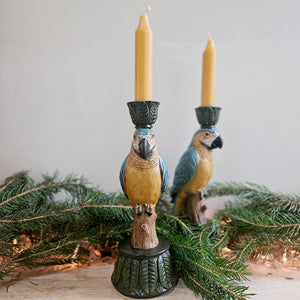 Parrot candle holders with Christmas lights and foliage