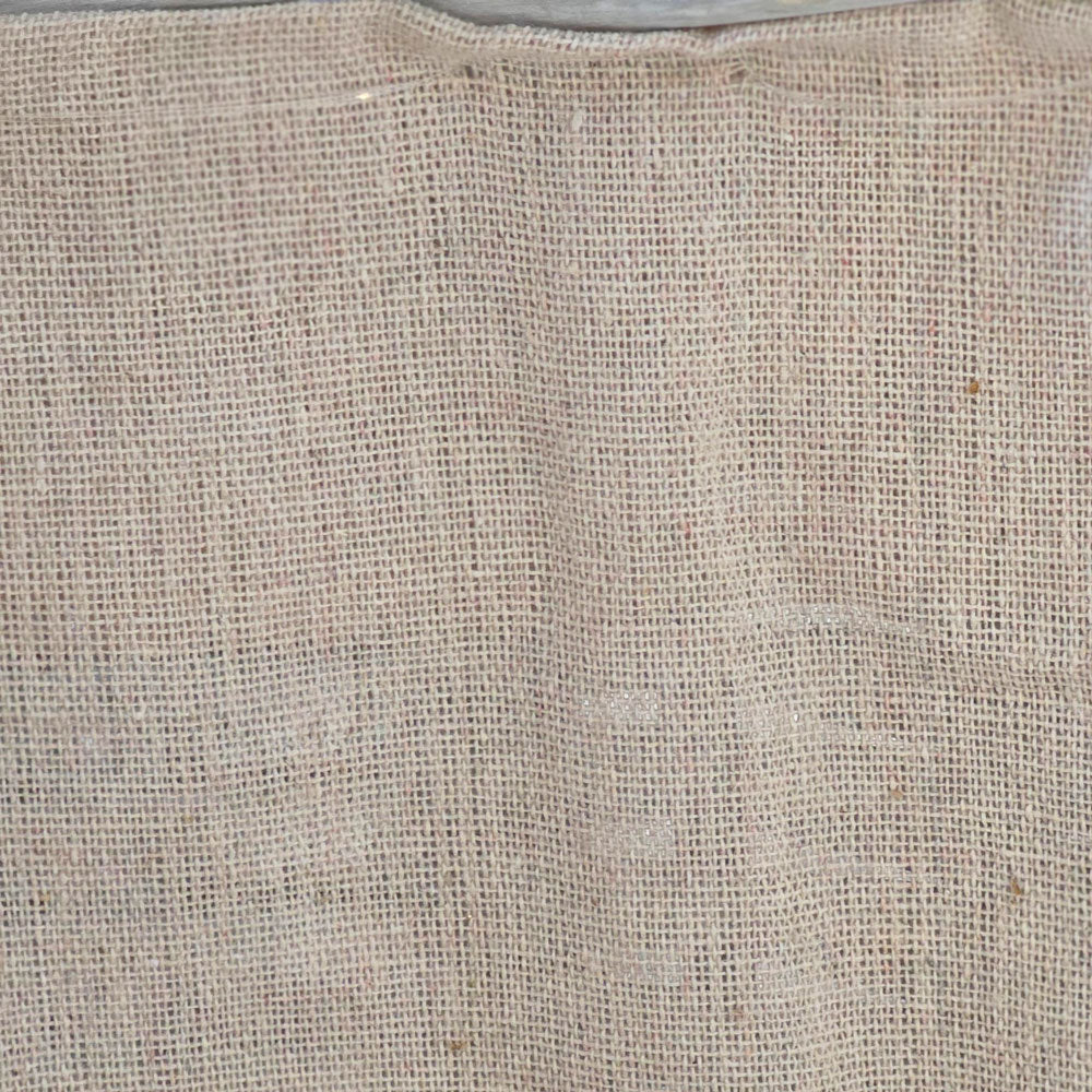 Close up of log basket hessian lining