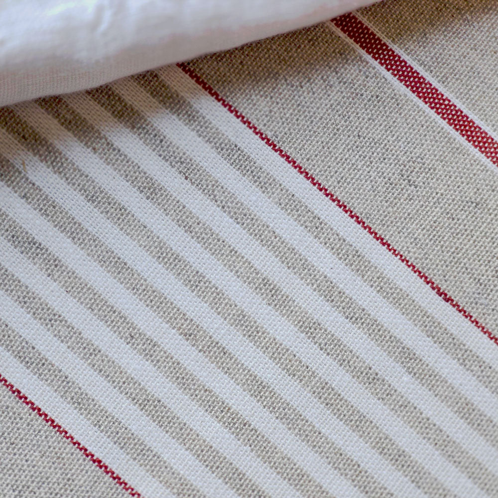 Close up of red striped wipe-clean tablecloth