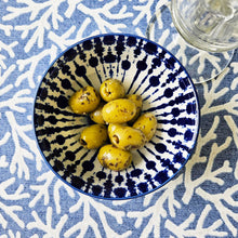 Reef coral oilcloth tablecloth with an Ikat bowl