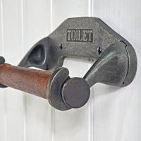 Metal toilet paper holder with wooden bar on a white background