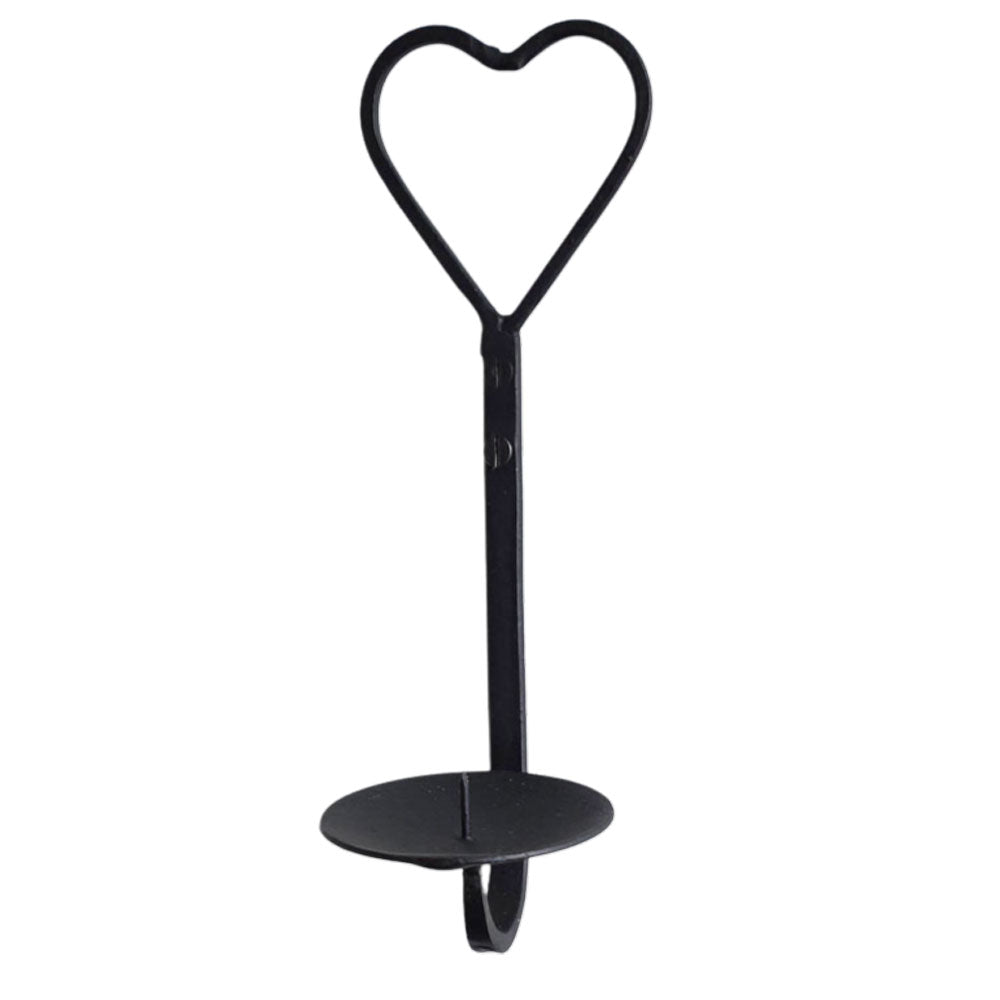 A black metal wall candle sconce with a heart-shaped top loop and a round candle base, shown against a plain white background.