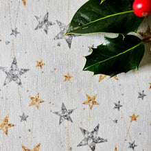 Close up of gold and silver star tablecloth