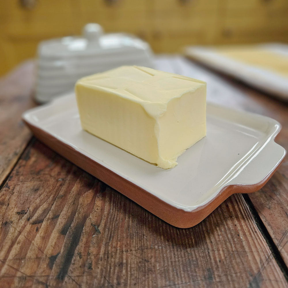 Butter on a ceramic butter dish base