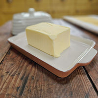 Butter on a ceramic butter dish base