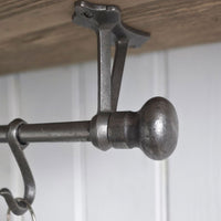 Close up of metal ball end finial on Highgate hooks