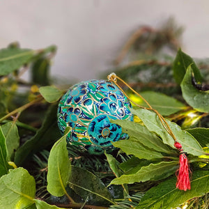 hand painted turquoise bauble with Christmas foliage