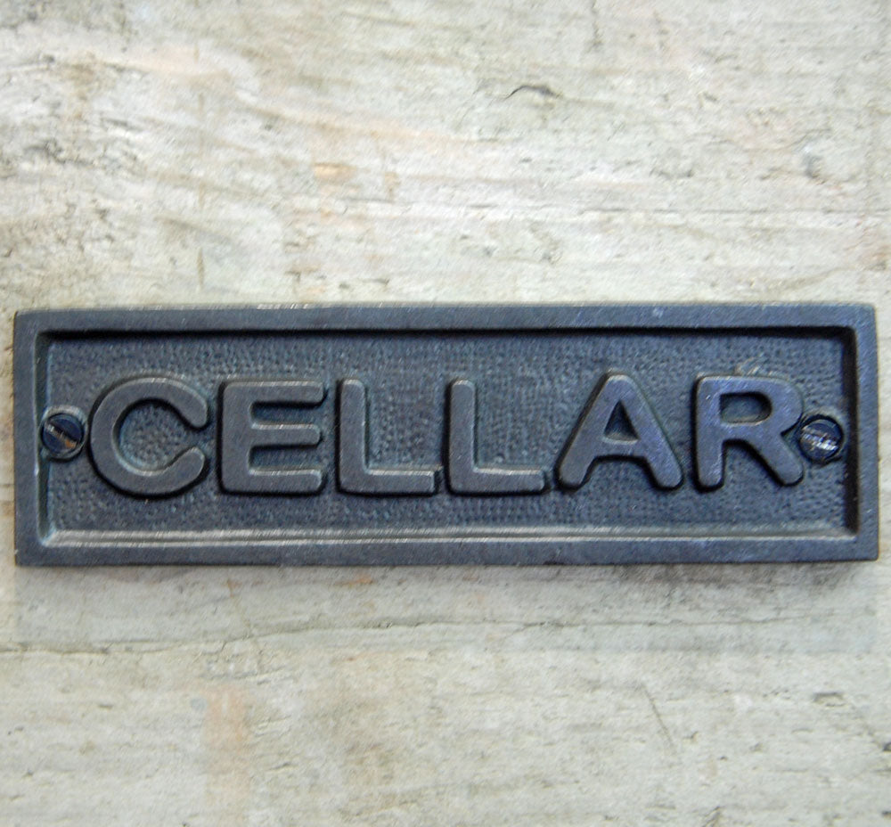 Traditional cast metal cellar door sign