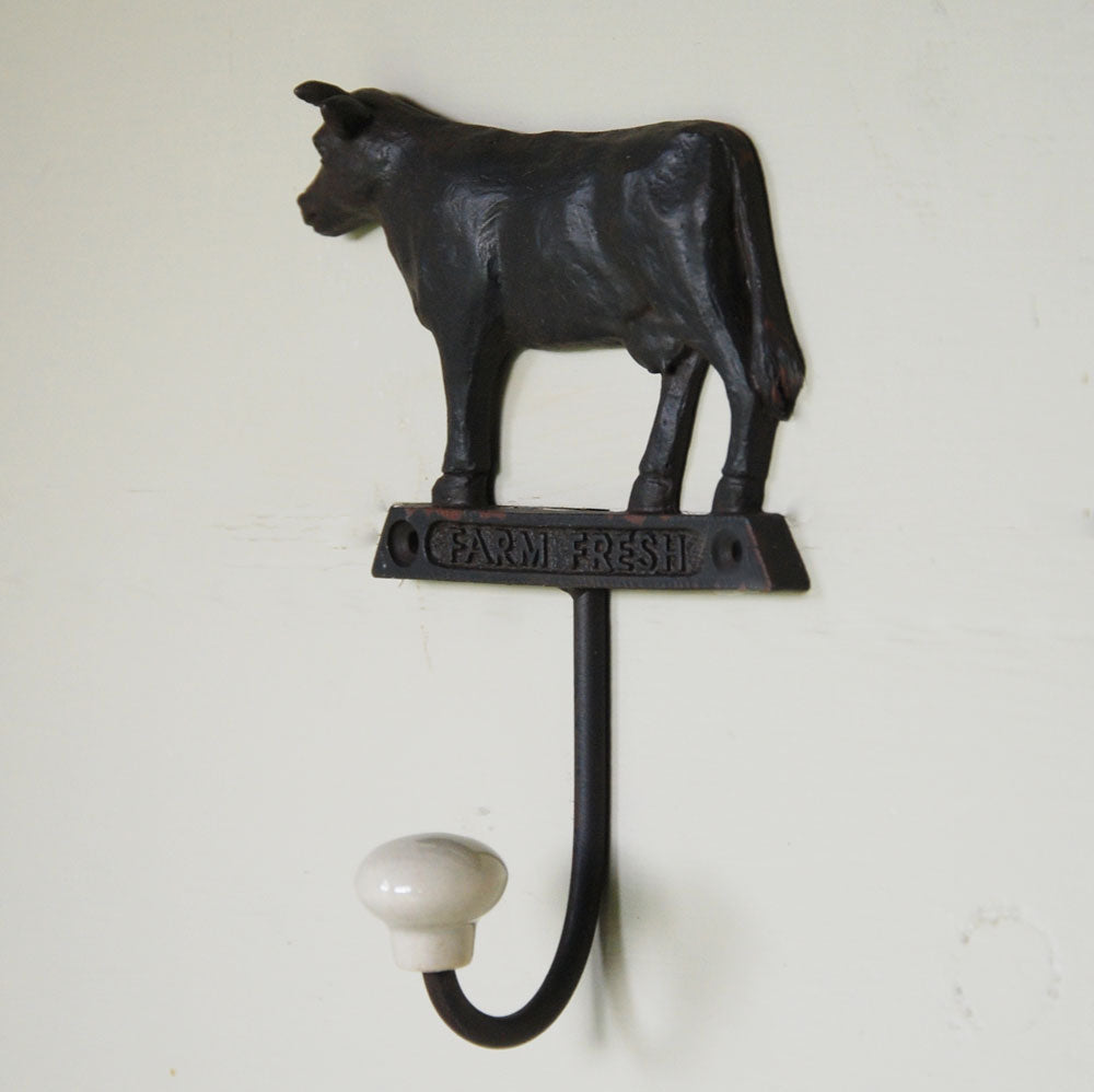 Vintage dark brown metal single dairy cow wall hook