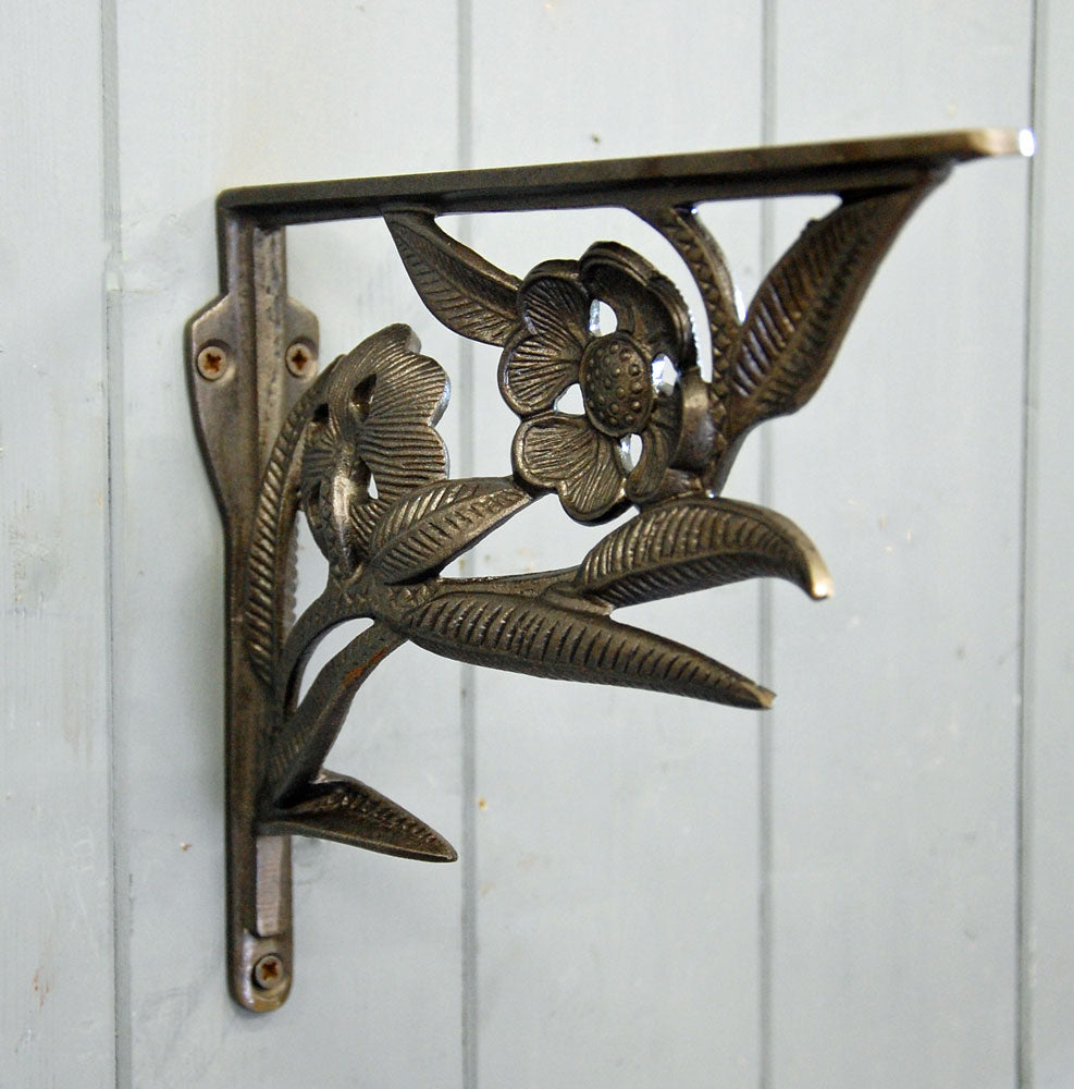 Deco flower antique style iron wall shelf bracket.