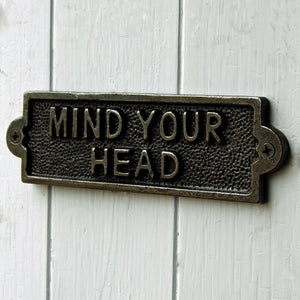 Cast metal mind your head plate sign