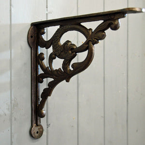 Serpent decorative cast metal wall shelf bracket