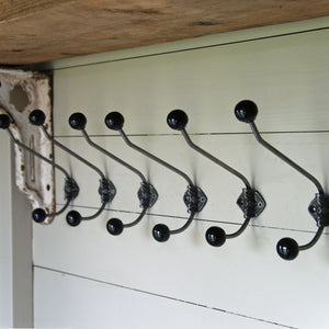 Set of six classic antique cast black rosette double coat wall hooks