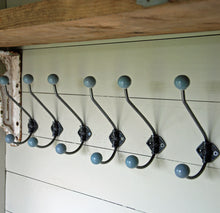 Set of six antique cast metal ceramic coat hook