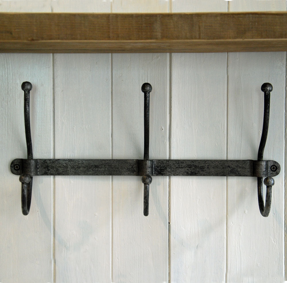 Row of industrial style galvanised coat hooks