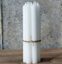 Tied bundle seven handmade Danish white dinner candles